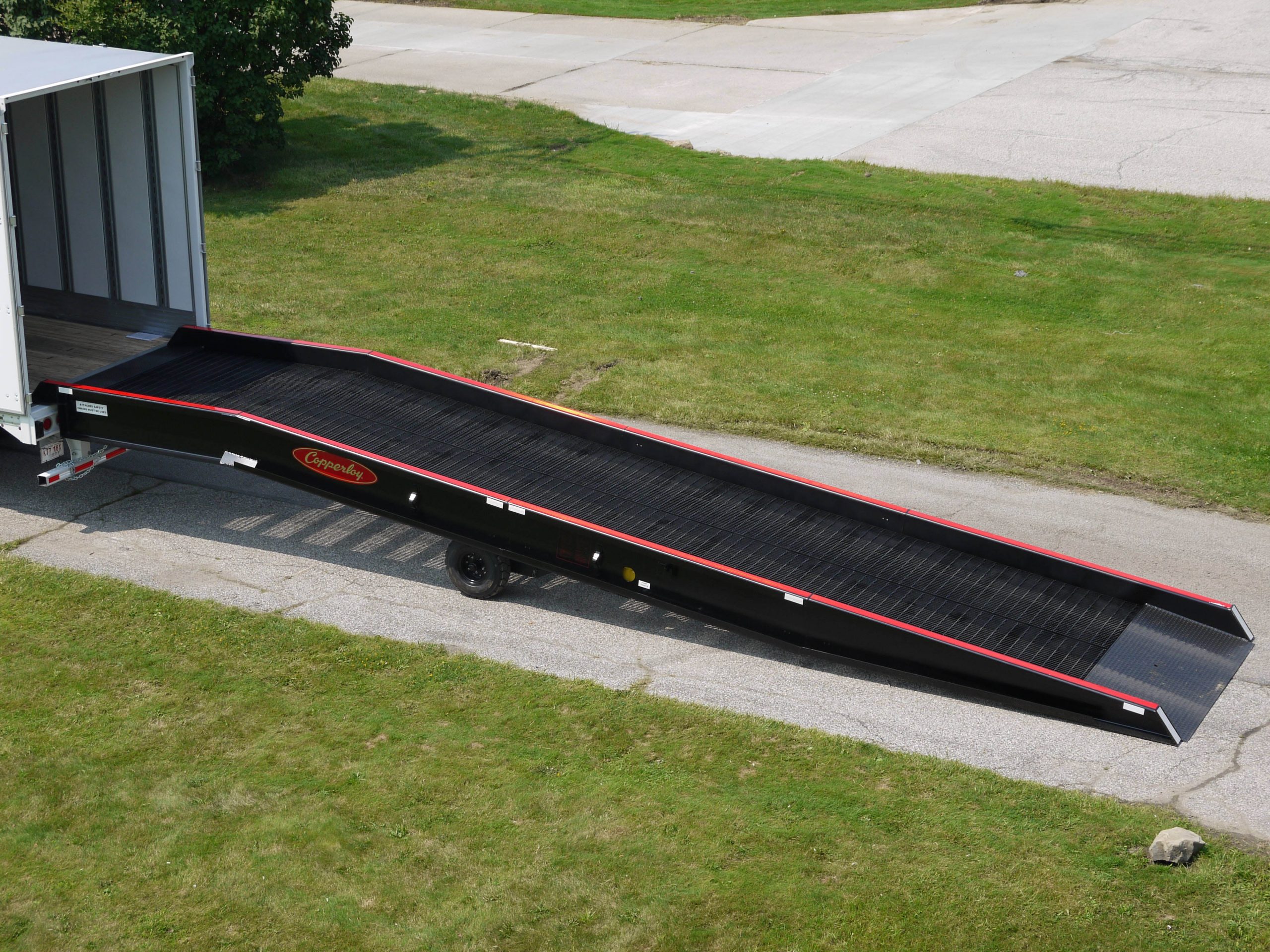 A distant view of one of Copperloy's Yard Ramps connected to a truck.